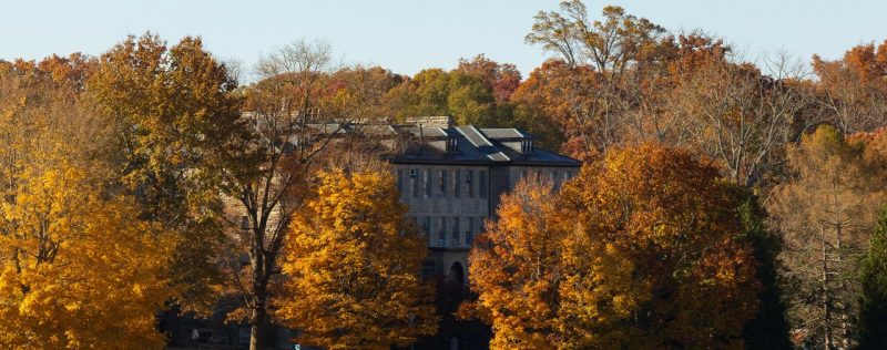 Fall colors Students cross the Drillfield on clear fall day.